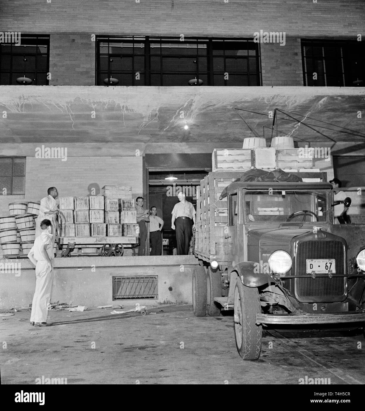 Vintage cars from the 1930s and 40s presented in a photo from the time