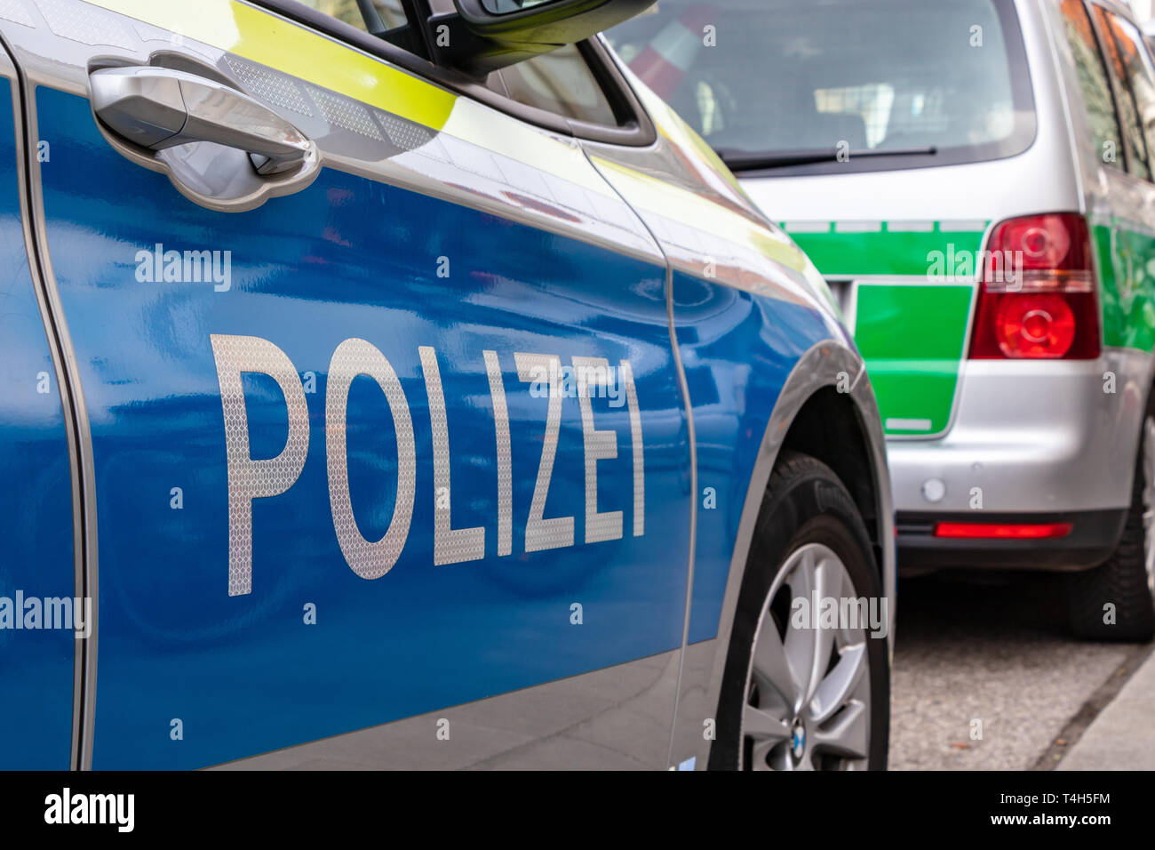 CENTRAL STATIONS, MUNICH, APRIL 6, 2019: blue and green german police ...
