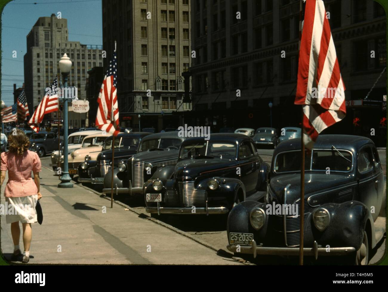 Vintage cars from the 1930s and 40s presented in a photo from the time
