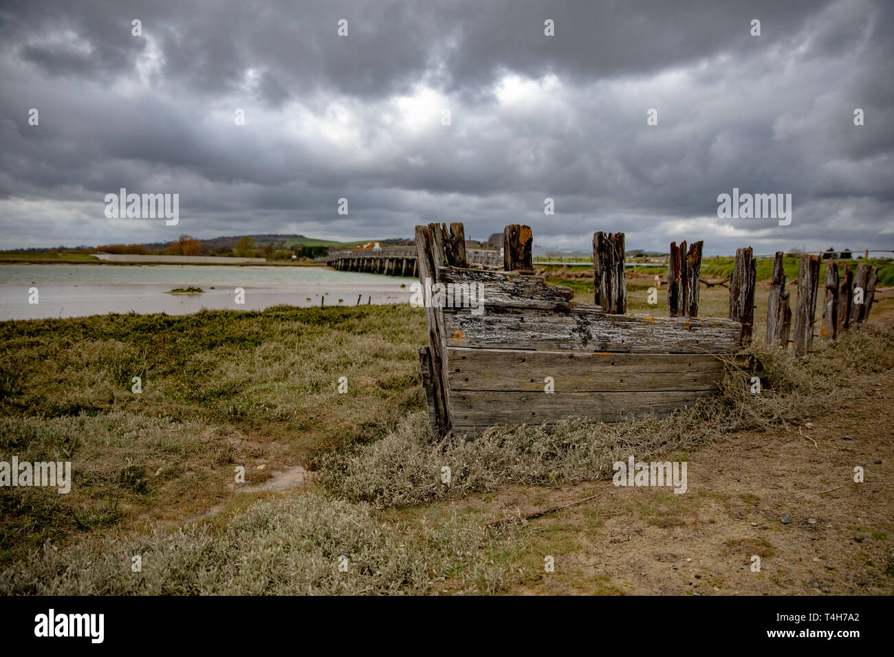 Wrecked wooden boat on the banks of the River Adur. Shoreham-by-Sea, Sussex. Stock Photo