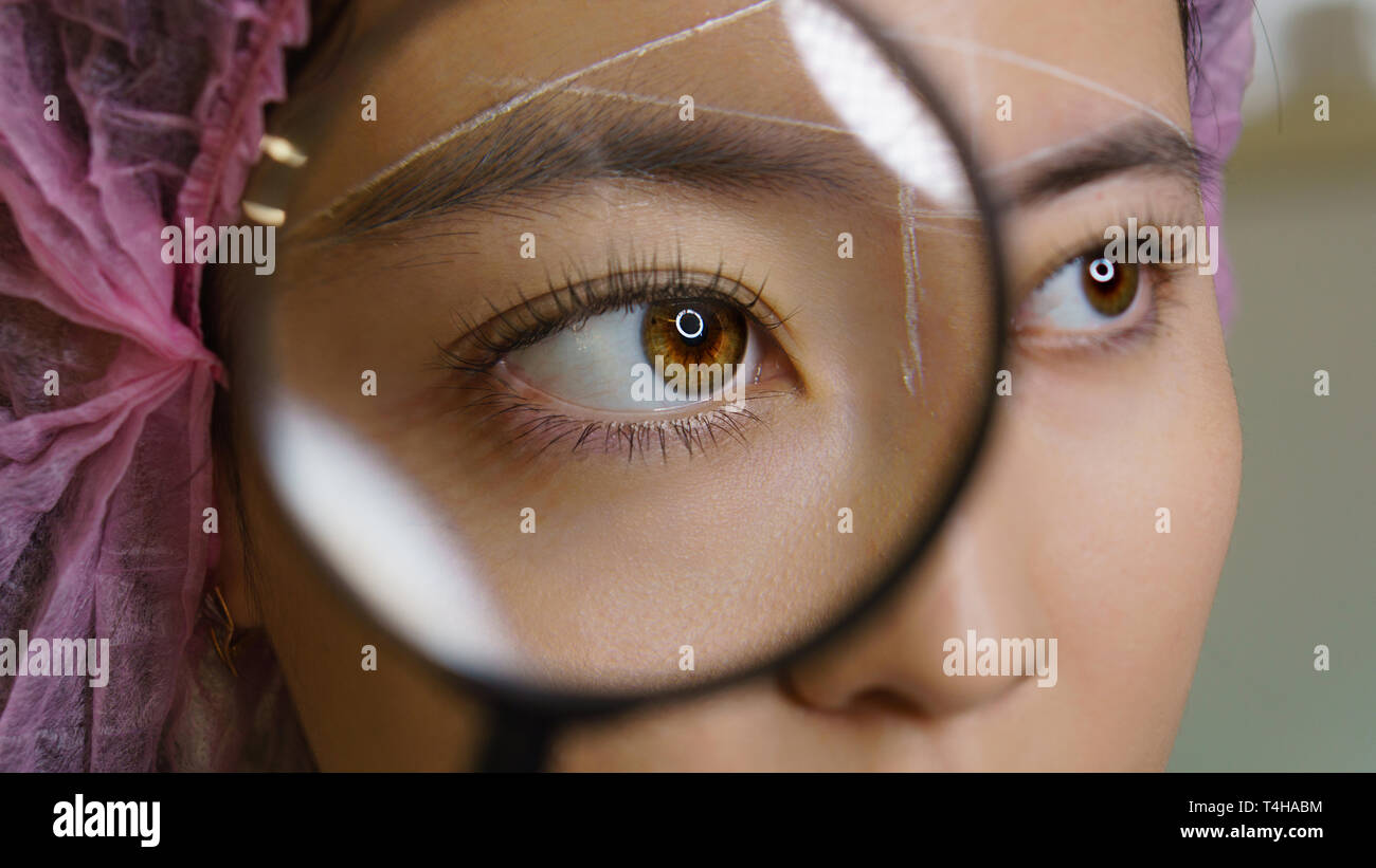 Microbleeding and eyebrow architecture. Eye and eyebrow of girl in