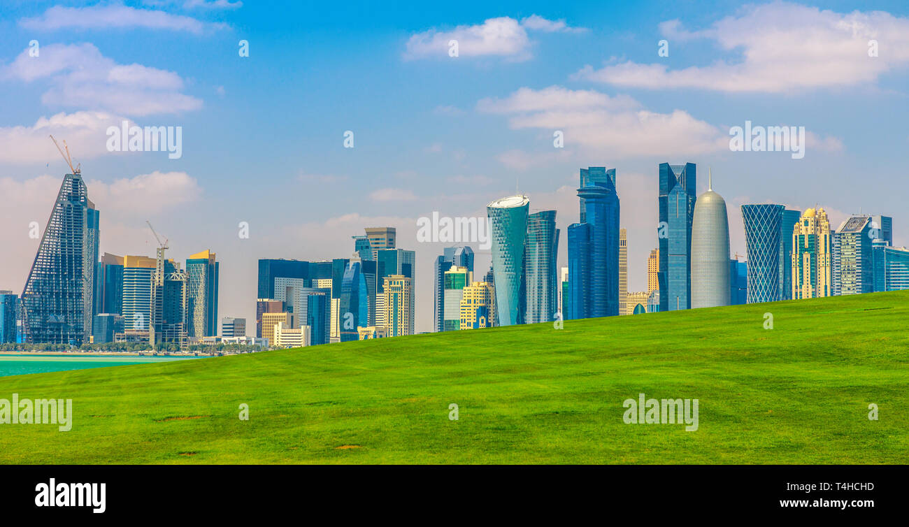 The Capital city of Qatar and Doha Bay from West Mound-Skyline viewpoint. Doha, Persian Gulf, Middle East, Arabian Peninsula. Sunny day. Urban scenary Stock Photo