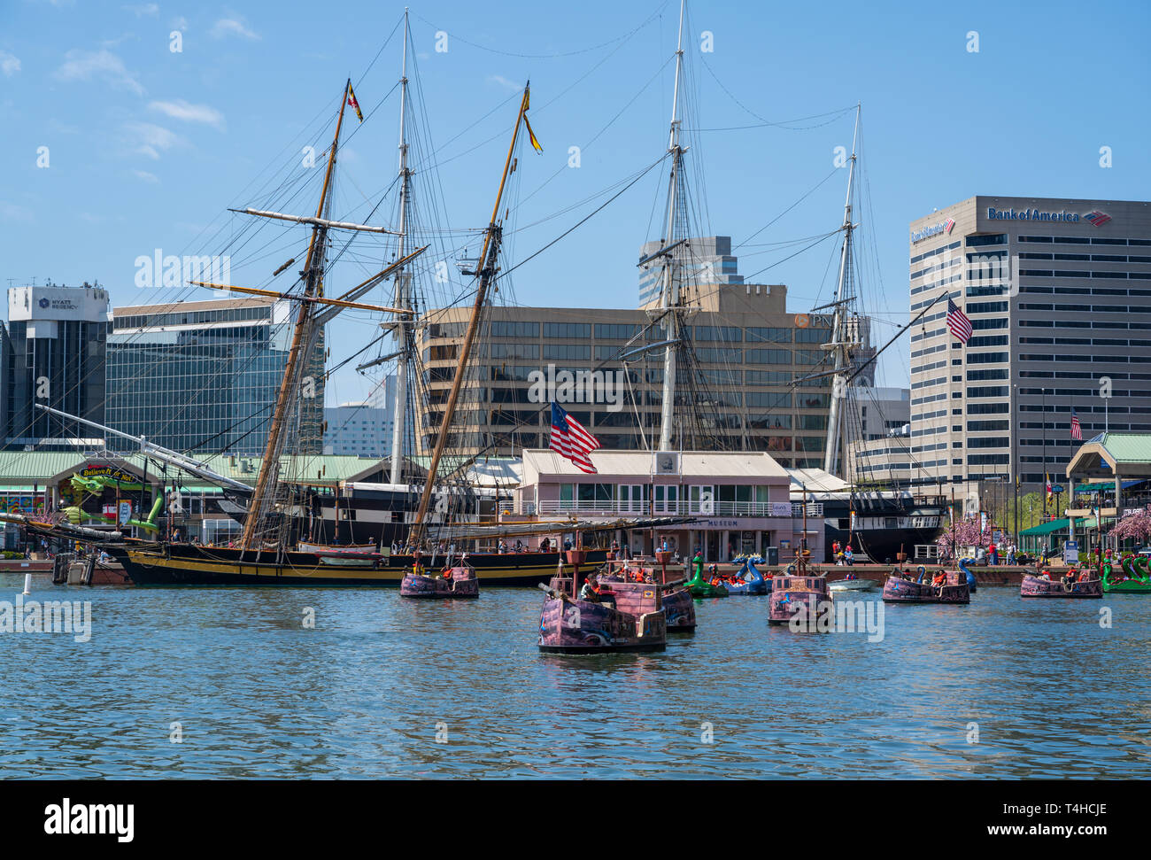 Baltimore, MD, USA April 13, 2019 Tourists ride colorful paddle