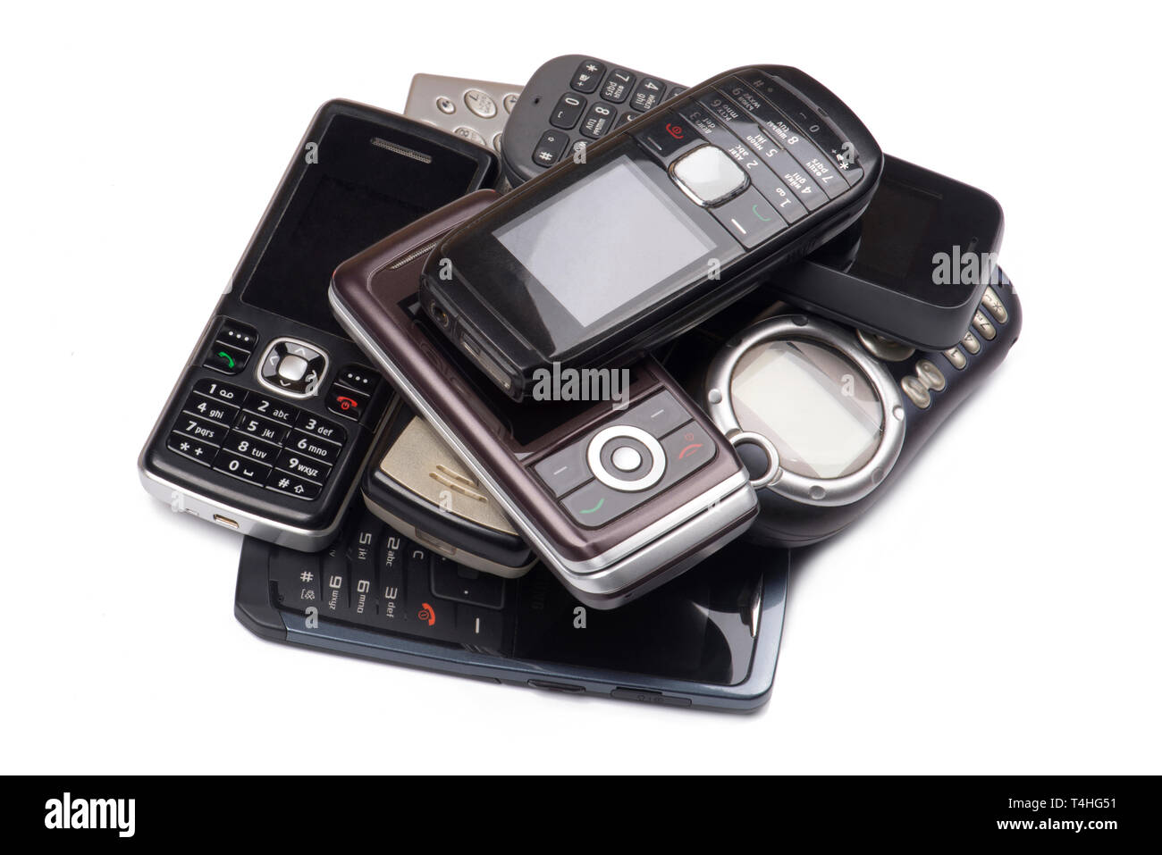 Heap of old mobile phones on white Stock Photo