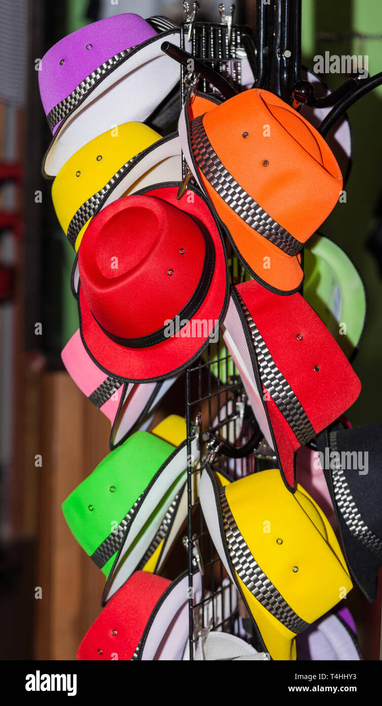 A colorful hat rack at a market Stock Photo