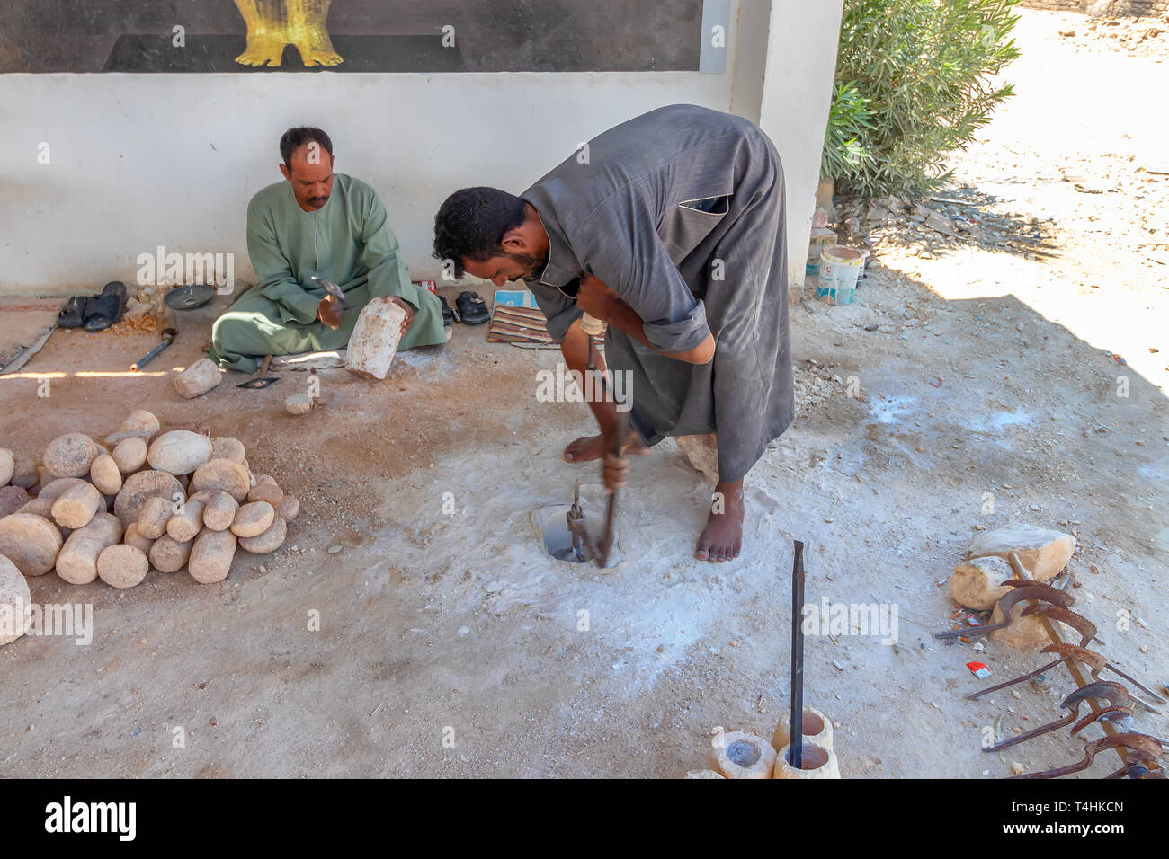 Luxor, Egypt September 11, 2018 Egyptian artisan drilling a