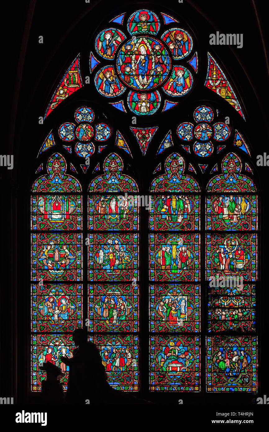 PARIS, FRANCE - APRIL 25: Stained glass window in Cathedral Notre Dame de Paris on april 25, 2011 in Paris. Stock Photo