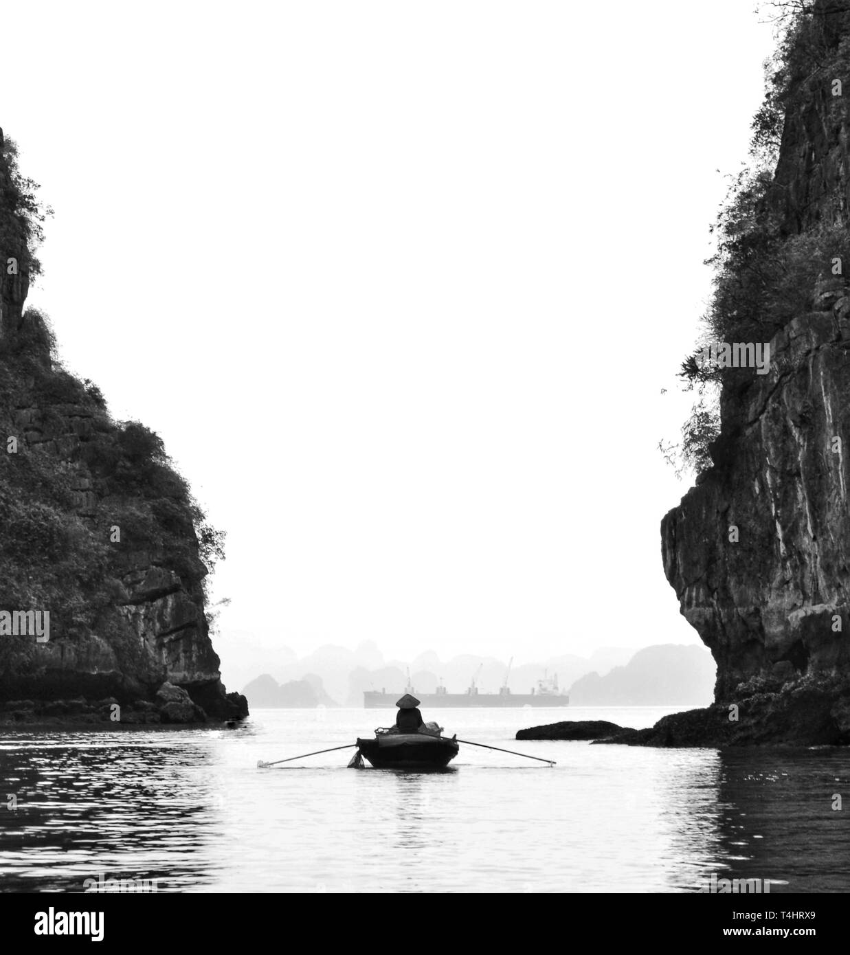 Paddling alone on Halong Bay, Vietnam Stock Photo
