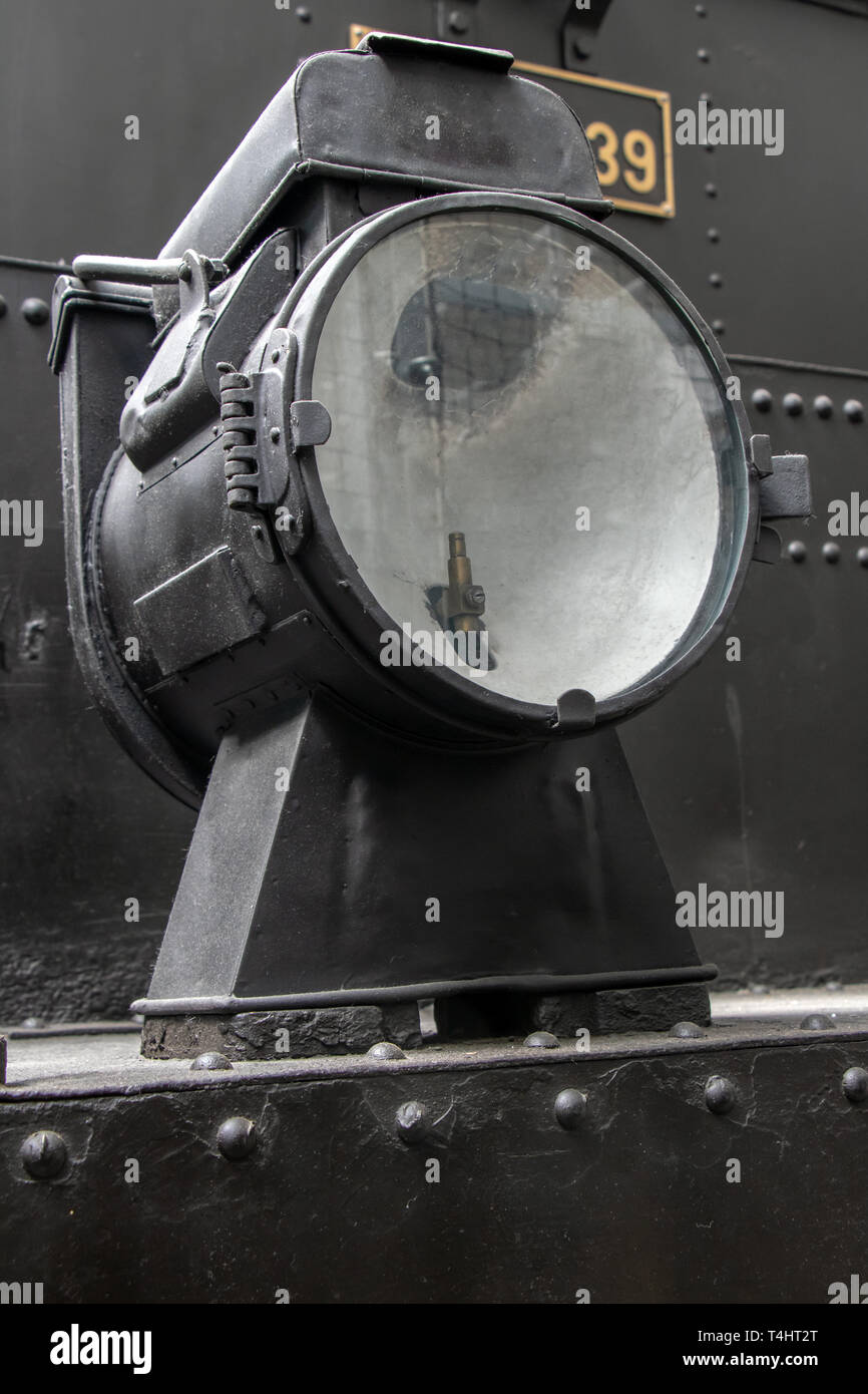 Old lamp on the steam locomotive.  Retro light in front part of train. Stock Photo