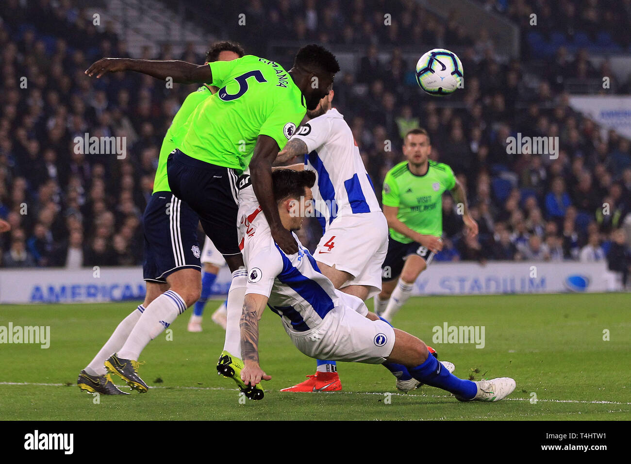 Brighton, UK. 16th Apr, 2019. Bruno Ecuele Manga of Cardiff City (L) heads the ball over Lewis Dunk of Brighton & Hove Albion (R). Premier League match, Brighton & Hove Albion v Cardiff City at the Amex Stadium in Brighton on Tuesday 16th April 2019. this image may only be used for Editorial purposes. Editorial use only, license required for commercial use. No use in betting, games or a single club/league/player publications. pic by Steffan Bowen/Andrew Orchard sports photography/Alamy Live news Credit: Andrew Orchard sports photography/Alamy Live News Stock Photo