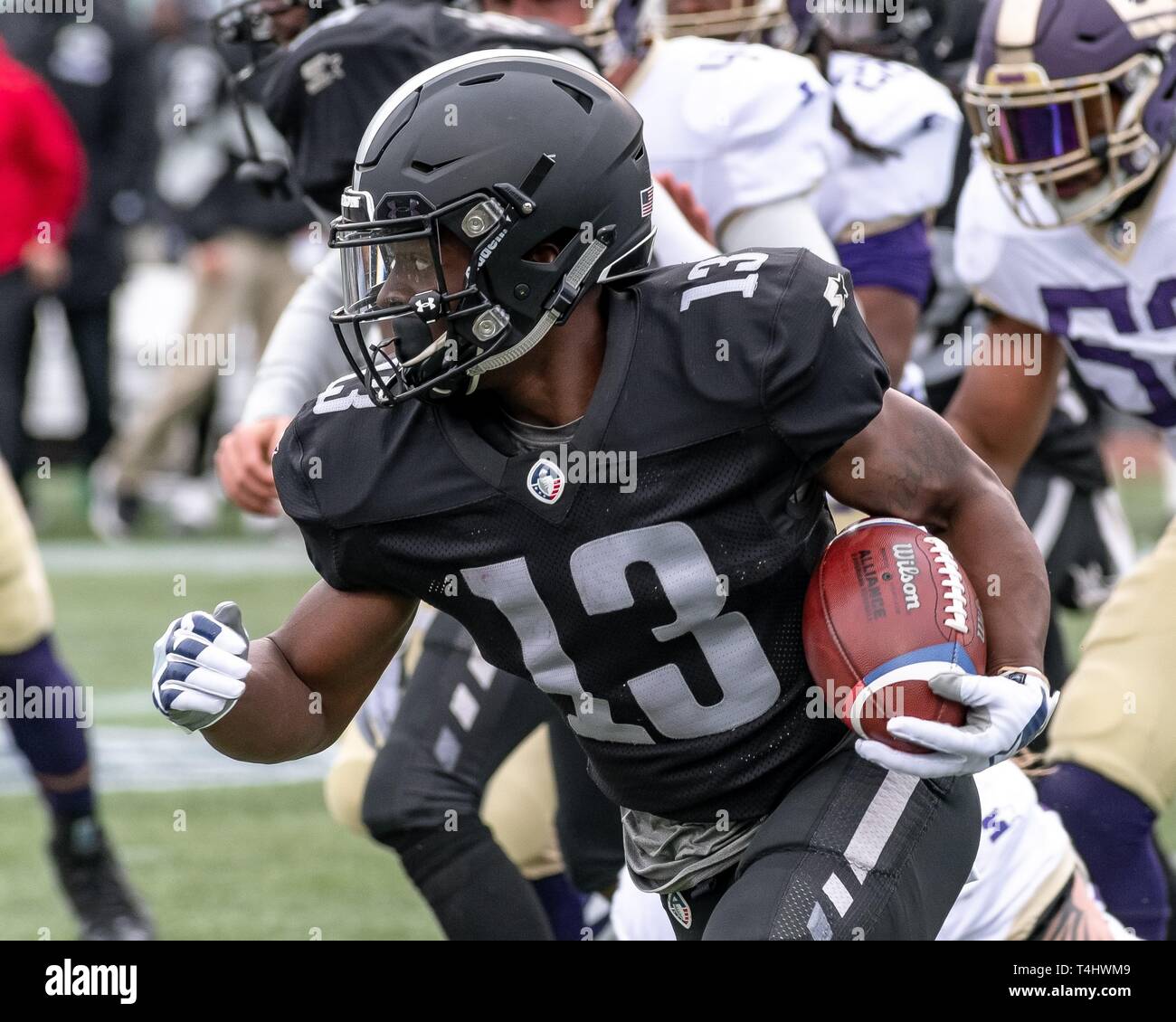 Birmingham, Alabama, USA. 31st Mar, 2019. The Birmingham Iron and the Atlanta Legends faced off in what was ultimately the last game for the two teams as the league dissolved just two days later. The Iron's home field is Legion Field, where the University of Alabama at Birmingham (UAB) plays. WR DEVOZEA FELTON (13) returns punt during the game. Credit: Jeremy Raines/ZUMA Wire/Alamy Live News Stock Photo