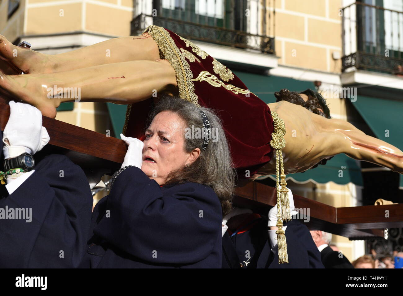 Madrid, Madrid, Spain. 16th Apr, 2019. Penitents from 'Cristo de Los Alabarderos' brotherhood are seen carrying a statue of Jesus Christ during the 'Cristo de Los Alabarderos' procession in Madrid.Cristo de Los Alabarderos procession, also known as the procession of Spanish Royal Guard, took place on the Holy Tuesday and in Good Friday in Madrid. Penitents carried a statue of Jesus Christ from 'De las Fuerzas Armadas' church to 'Real' palace in central Madrid and on Good Friday penitents will march in reverse, this has been celebrated since 1753 and it is one of the most important processio Stock Photo