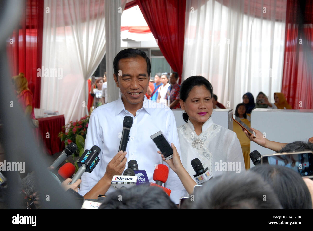 Indonesian President Joko Jokowi Widodo And His Wife Iriana Are Welcomed By School Staff Upon Arrival To Attend Their Son S Graduation Ceremony At Anglo Chinese School Acs International In Singapore November 21 2014