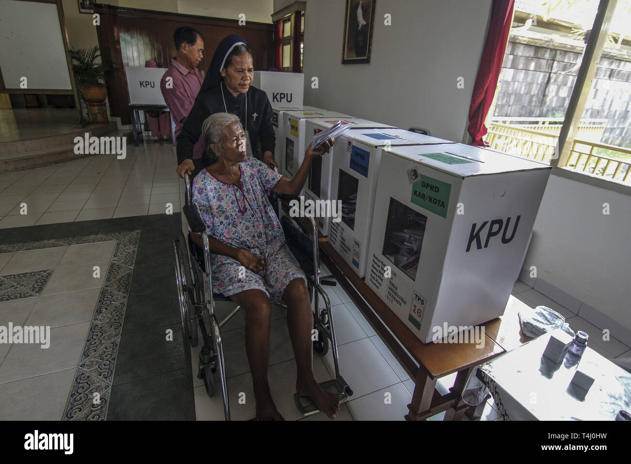 Yogyakarta, INDONESIA. 17th Apr, 2019. A Catholic nun helps an elderly Muslim woman to vote in a polling station in a monastery in Yogyakarta, Indonesia, Wednesday, April 17 2019. Millions of Indonesians vote in presidential and legislative elections with former presidential candidates Joko Widodo and former Prabowo Subianto Soeharto's son-in-law general who led Indonesia for 32 years. Credit: Slamet Riyadi/ZUMA Wire/Alamy Live News Stock Photo