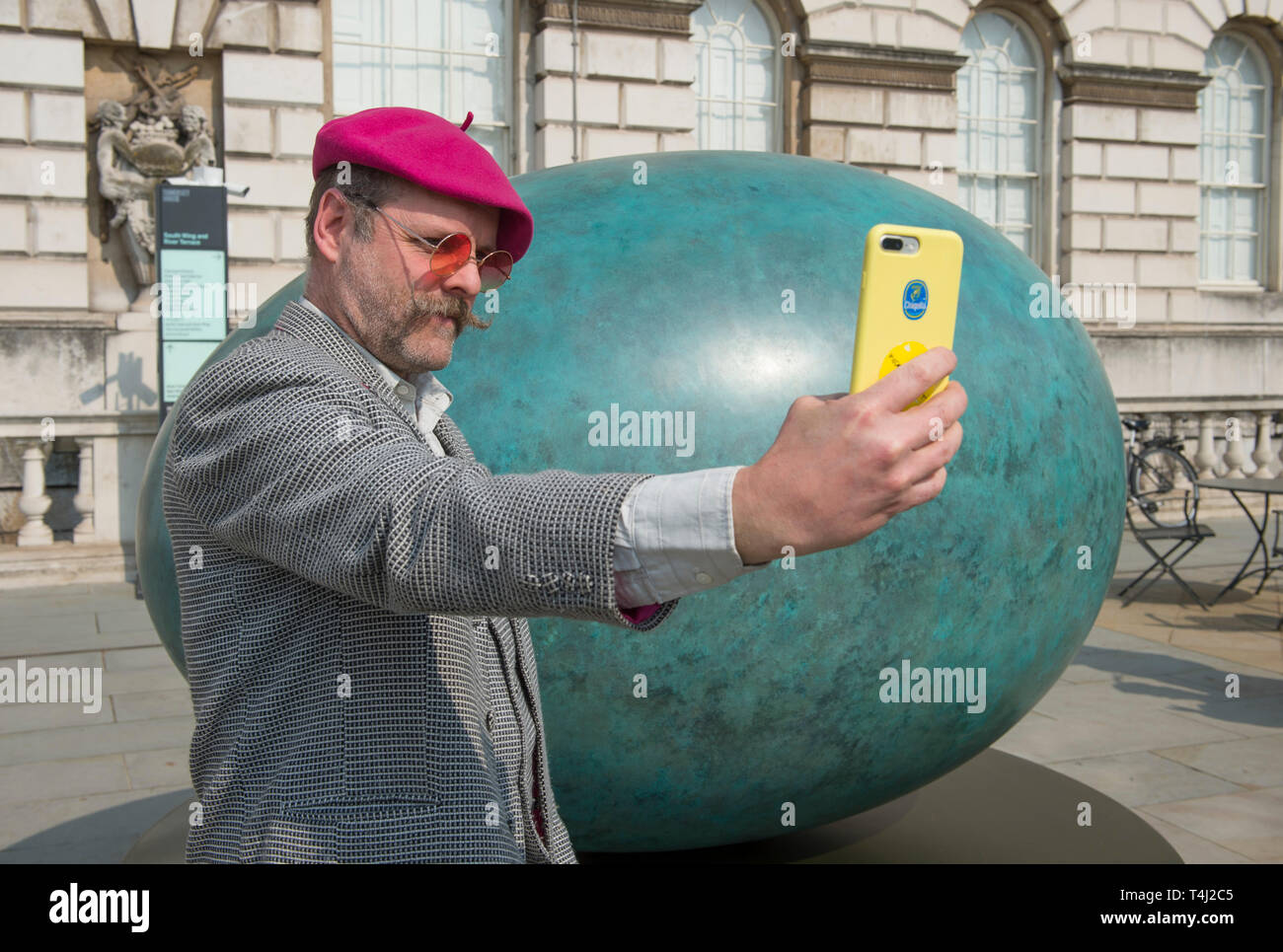 https://c8.alamy.com/comp/T4J2C5/london-uk-17th-april-2019-a-giant-bronze-egg-sculpture-oeuvre-by-gavin-turk-pictured-is-unveiled-at-somerset-house-the-bronze-egg-is-intended-as-a-starting-point-and-inspiration-for-photographers-around-the-world-to-collaborate-with-gavin-on-an-ambitious-public-installation-for-photo-london-titled-gavin-turk-portrait-of-an-egg-all-that-is-required-to-take-part-is-a-digital-photographic-device-with-which-to-record-their-own-portrait-of-an-egg-credit-malcolm-parkalamy-live-news-T4J2C5.jpg