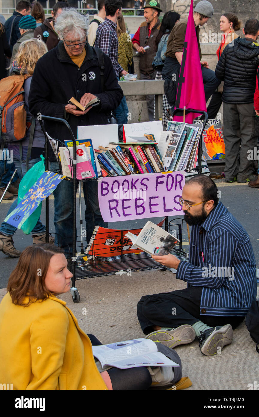 London, UK. 17th Apr, 2019. The library - The evening generally has a festival atmosphere - Day 3 - Protestors from Extinction Rebellion block several junctions in London as part of their ongoing protest to demand action by the UK Government on the 'climate chrisis'. The action is part of an international co-ordinated protest. Credit: Guy Bell/Alamy Live News Stock Photo