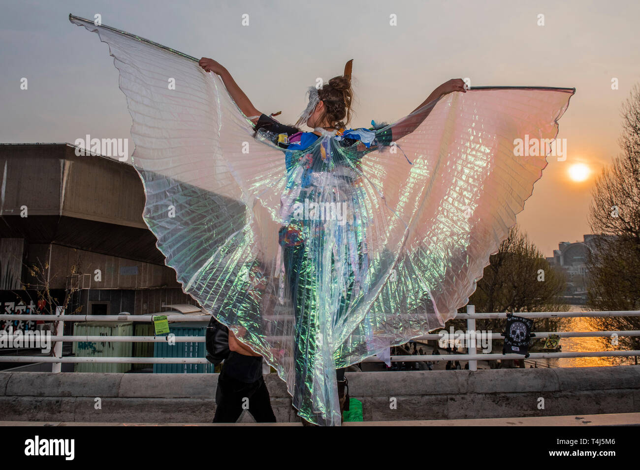 London, UK. 17th Apr, 2019. Dancers with dresses made out the plastic waste that is now being found in sea birds - The evening generally has a festival atmosphere - Day 3 - Protestors from Extinction Rebellion block several junctions in London as part of their ongoing protest to demand action by the UK Government on the 'climate chrisis'. The action is part of an international co-ordinated protest. Credit: Guy Bell/Alamy Live News Stock Photo