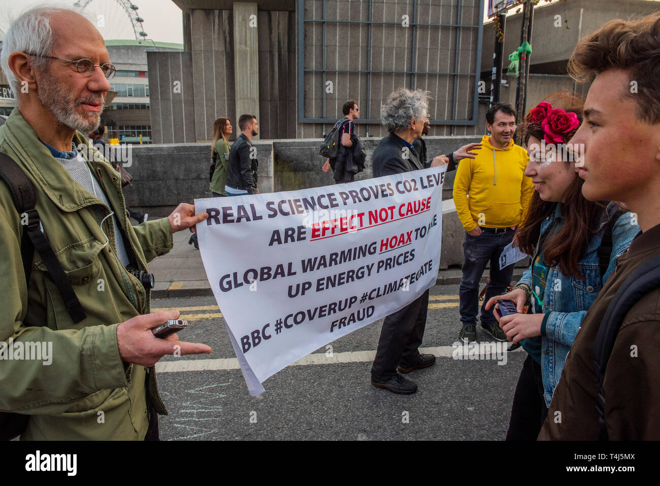London, UK. 17th Apr, 2019. Climate change skeptics come to confront the rebellion -  The evening generally has a festival atmosphere - Day 3 - Protestors from Extinction Rebellion block several junctions in London as part of their ongoing protest to demand action by the UK Government on the 'climate chrisis'. The action is part of an international co-ordinated protest. Credit: Guy Bell/Alamy Live News Stock Photo