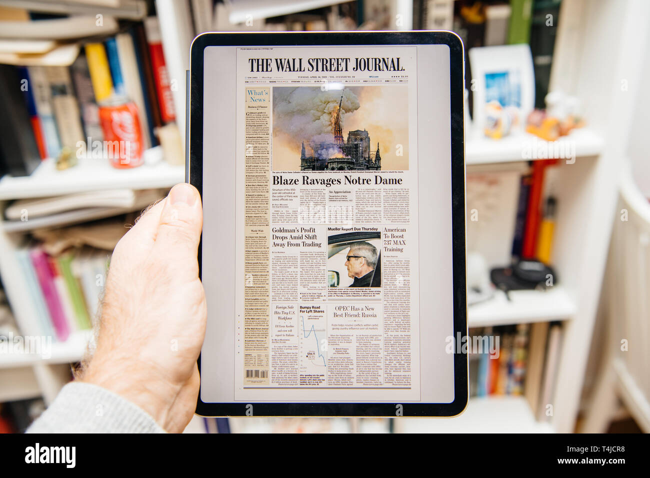 Paris, France - Apr 15, 2019: Man reading on iPad Pro Apple News 