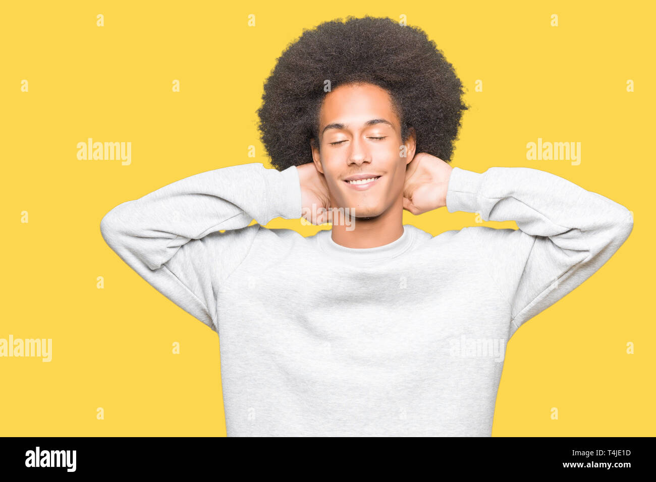 Young African American Man With Afro Hair Wearing Sporty