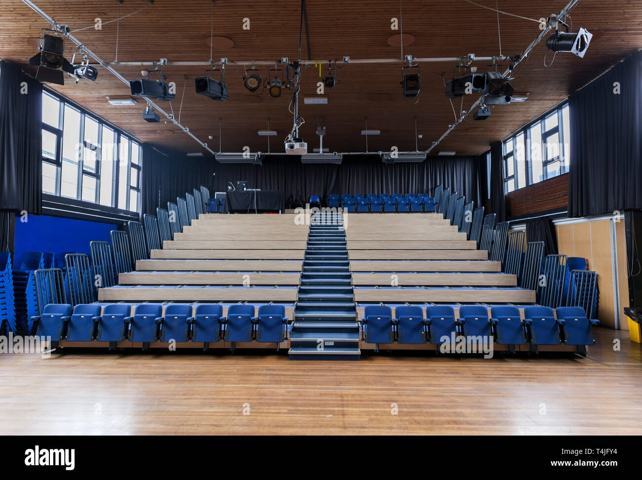 School theatre with collapsible tiered seating which is common in