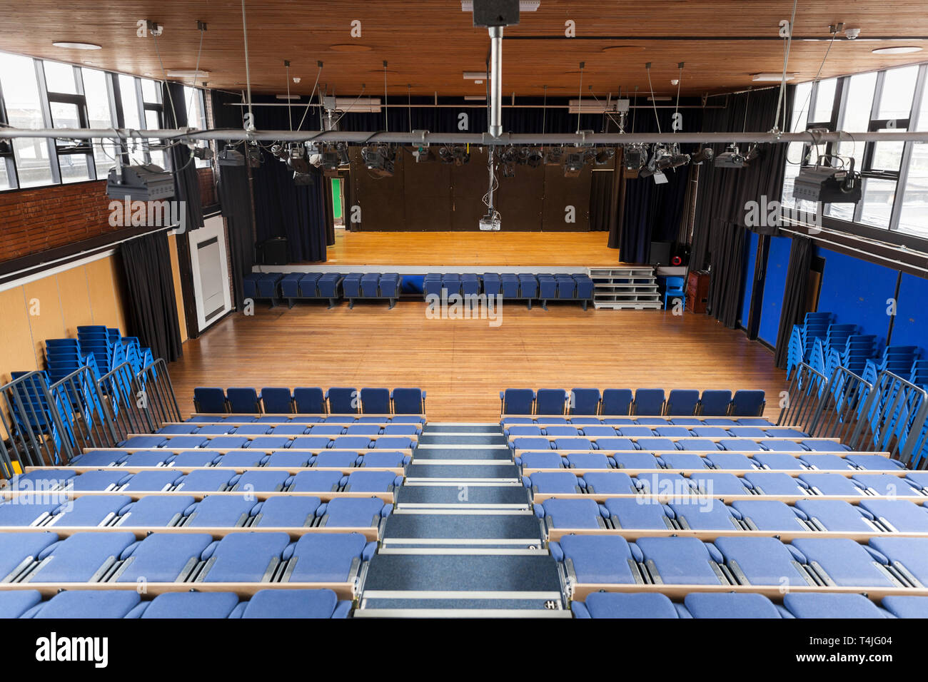 School theatre with collapsible tiered seating which is common in