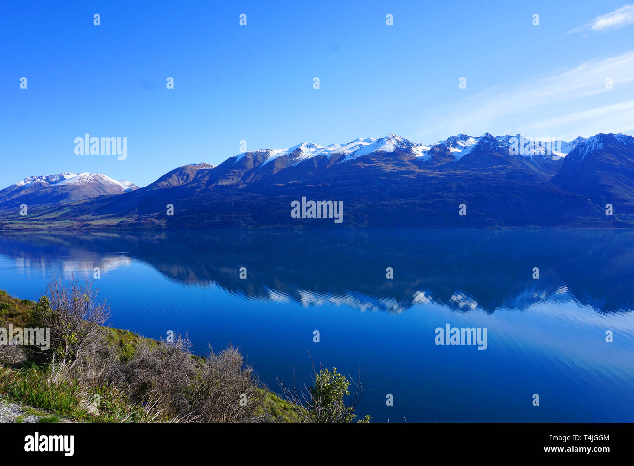 Peaceful mountain landscape with clear blue sky and white clouds hi-res ...