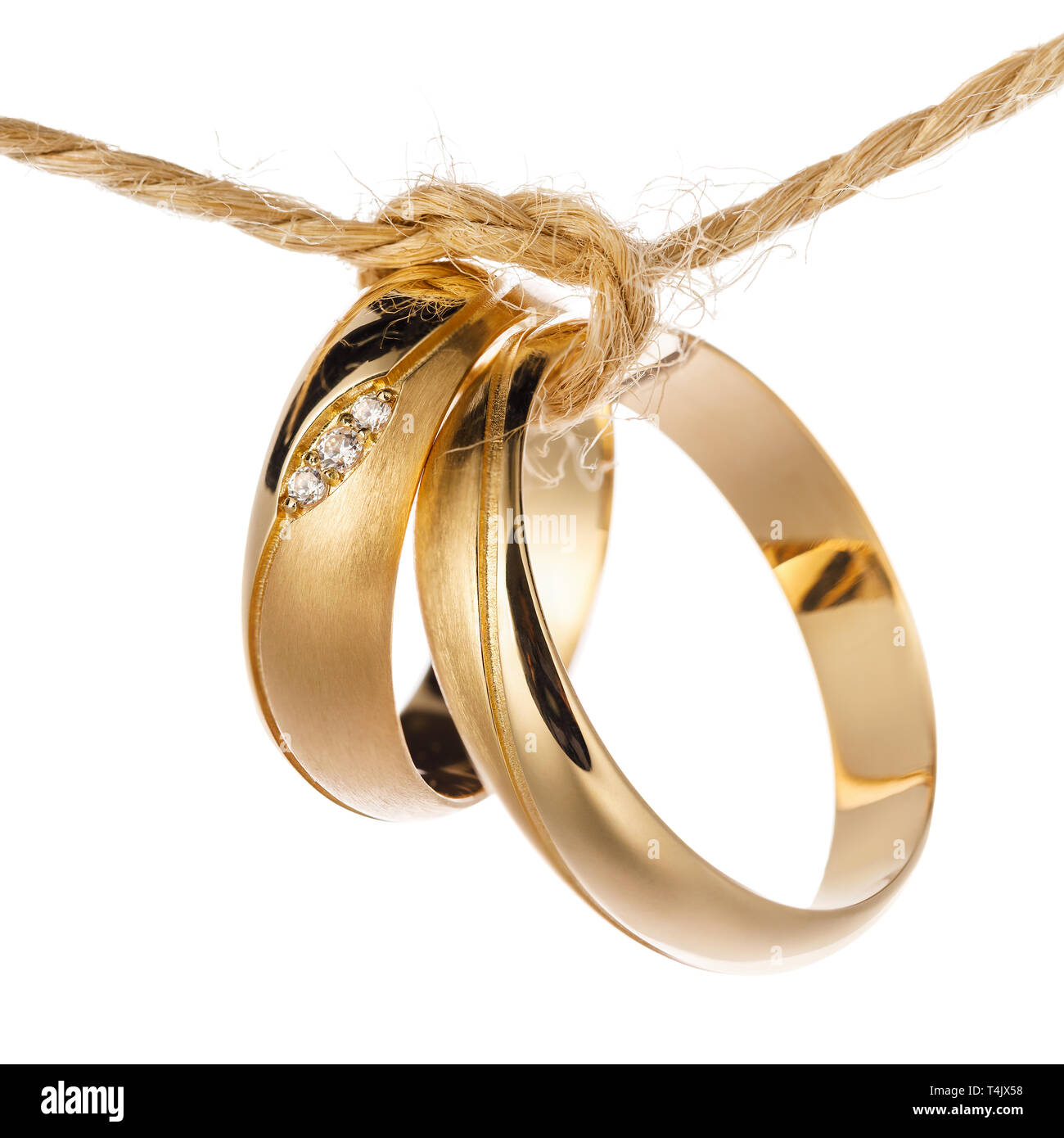 Two wedding rings tied with a rope as a symbol of the union of a new  family, isolated on white background Stock Photo - Alamy