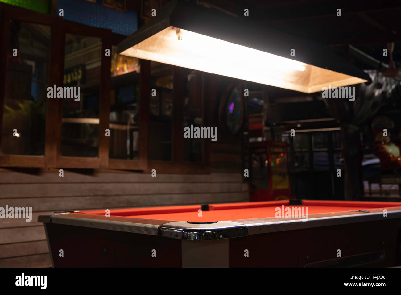 Vintage pool table in night club, pool snooker billiard concept background. Stock Photo