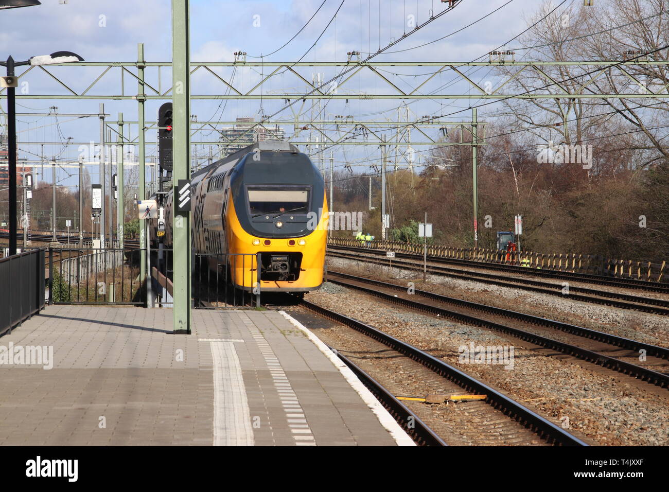 VIRM intercity double decker train at the trainstation of Den Haag Laan van NOI in the Netherlands Stock Photo