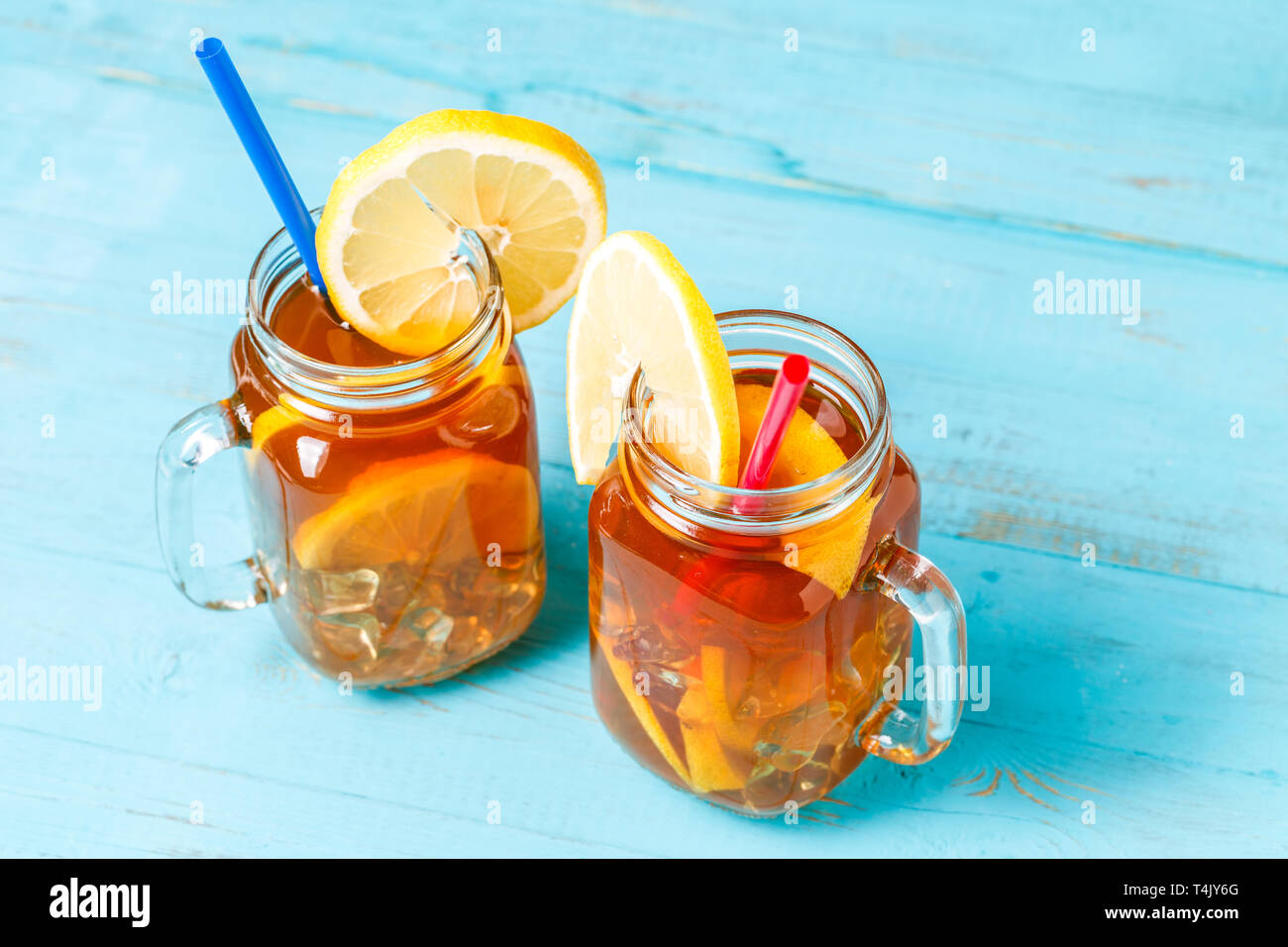 Iced tea in a glass jar with lemon Stock Photo Alamy