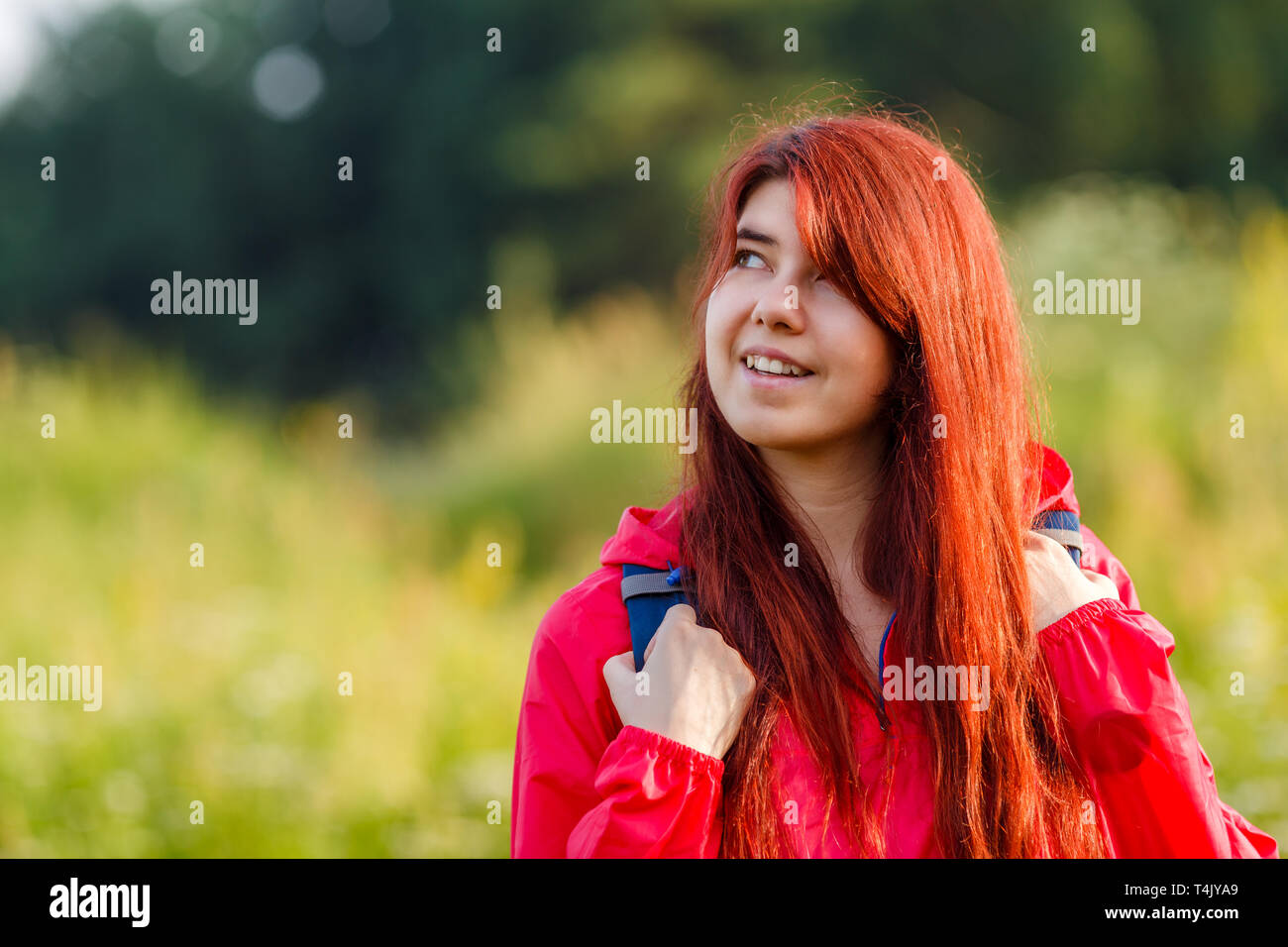Photo of smiling girl and with backpack Stock Photo - Alamy