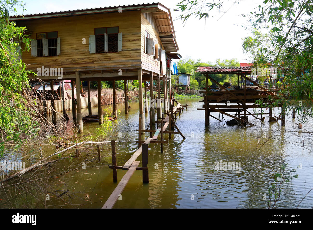 wooden house flooded, old rural house in water Stock Photo