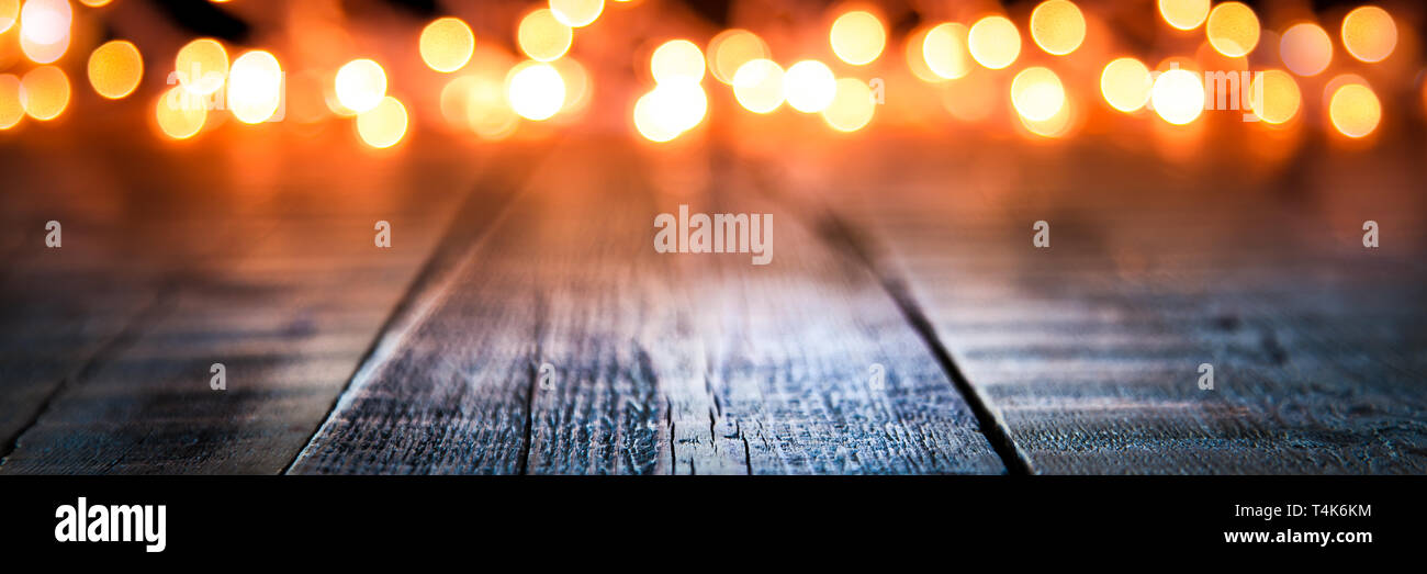 Bokeh Of Christmas Lights On Vintage Wooden Plank Table Stock Photo - Alamy