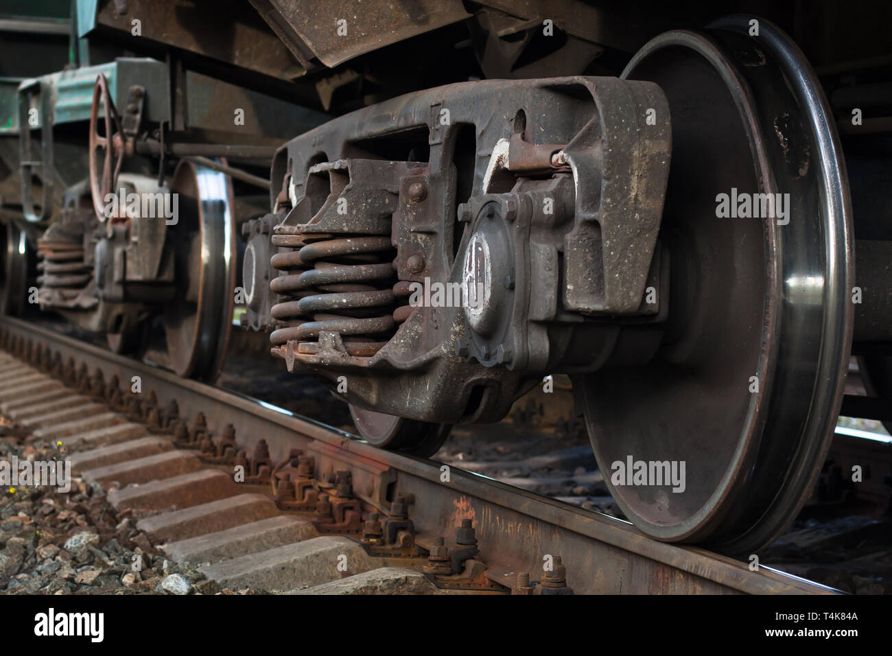 wheel of railway car on rails, closeup Stock Photo