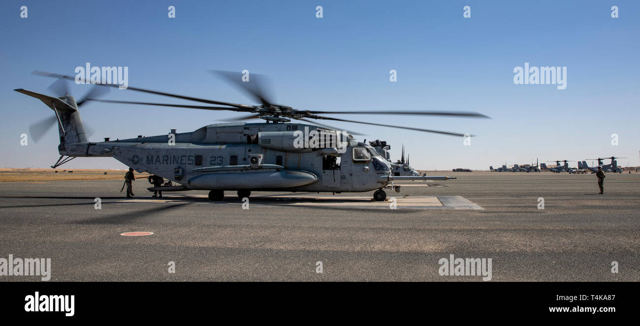 CAMP BEUHRING, Kuwait (April 14, 2019) A U.S. Marine CH-53E Super Stallion with the 22nd Marine Expeditionary Unit prepares for takeoff during a MEU exercise. Aircraft with Marine Medium Tiltrotor Squadron (VMM) 264 (Reinforced) carry out routine flights in order to maintain operational readiness. Marines and Sailors with the 22nd MEU and Kearsarge Amphibious Ready Group are currently deployed to the U.S. 5th Fleet area of operations in support of naval operations to ensure maritime stability and security in the Central region, connecting the Mediterranean and the Pacific through the western I Stock Photo