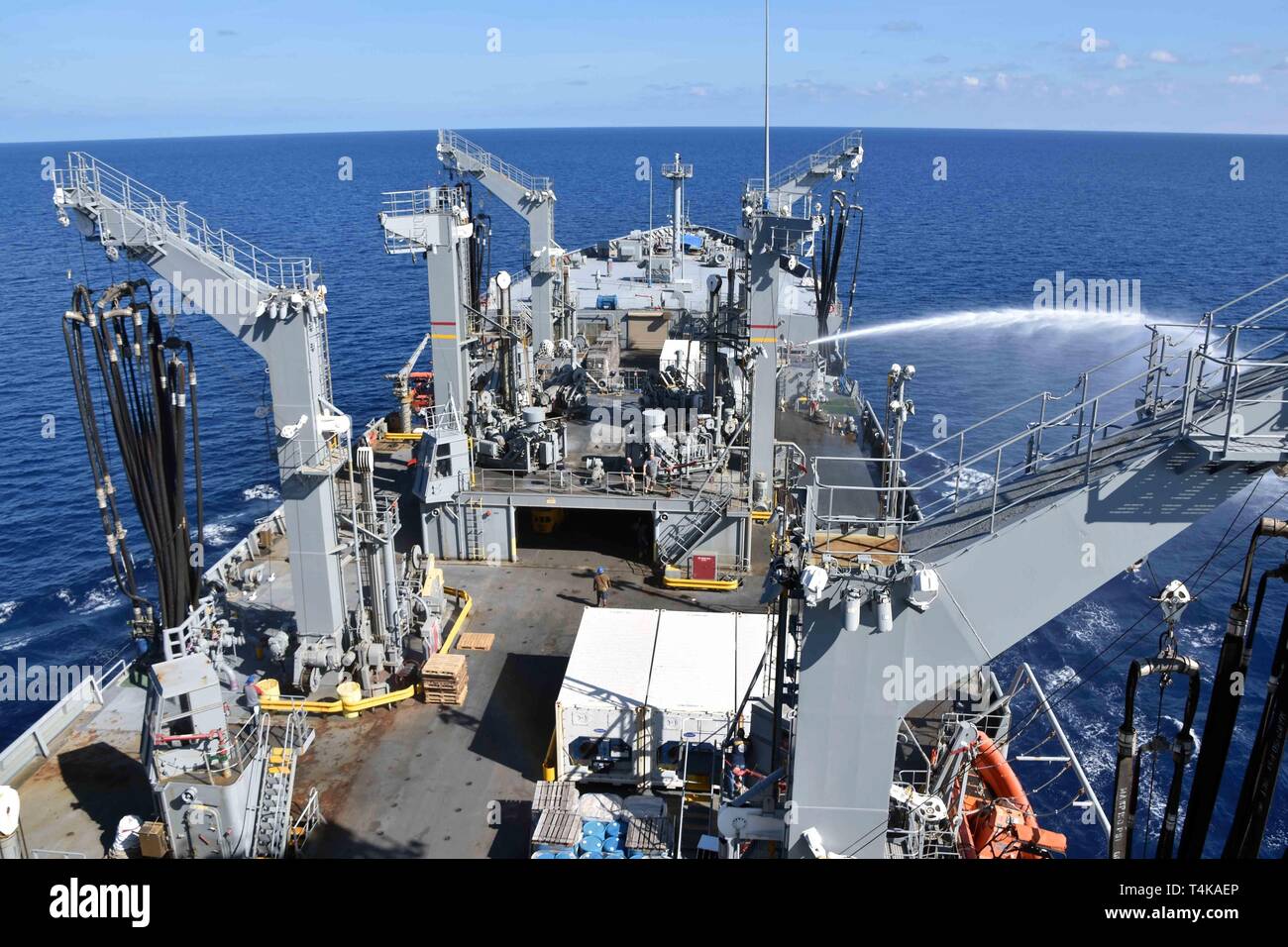 190416-N-WF604-012 INDIAN OCEAN (April 16, 2019) -- Civilian mariners onboard fleet replenishment oiler USNS Guadalupe (T-AO 200) perform testing of the ship's Foam Fire Monitoring System April 16. Military Sealift Command fleet replenishment oilers provide fuel and dry cargo support to customers via underway and vertical replenishments. (Photo by David Wyscaver) Stock Photo