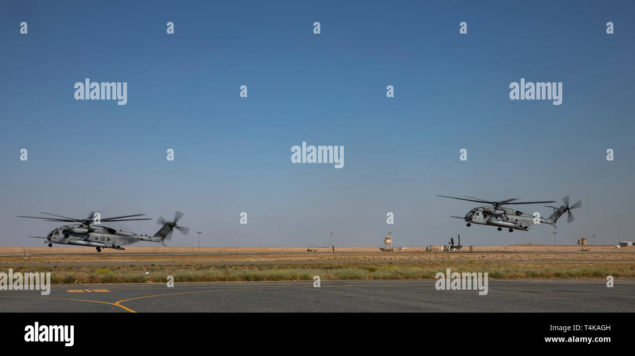 CAMP BEUHRING, Kuwait (April 14, 2019) U.S. Marine CH-53E Super Stallions with the 22nd Marine Expeditionary Unit takeoff from the runway during a MEU exercise. Aircraft with Marine Medium Tiltrotor Squadron (VMM) 264 (Reinforced) carry out daily routine flights in order to maintain operational readiness. Marines and Sailors with the 22nd MEU and Kearsarge Amphibious Ready Group are currently deployed to the U.S. 5th Fleet area of operations in support of naval operations to ensure maritime stability and security in the Central region, connecting the Mediterranean and the Pacific through the w Stock Photo