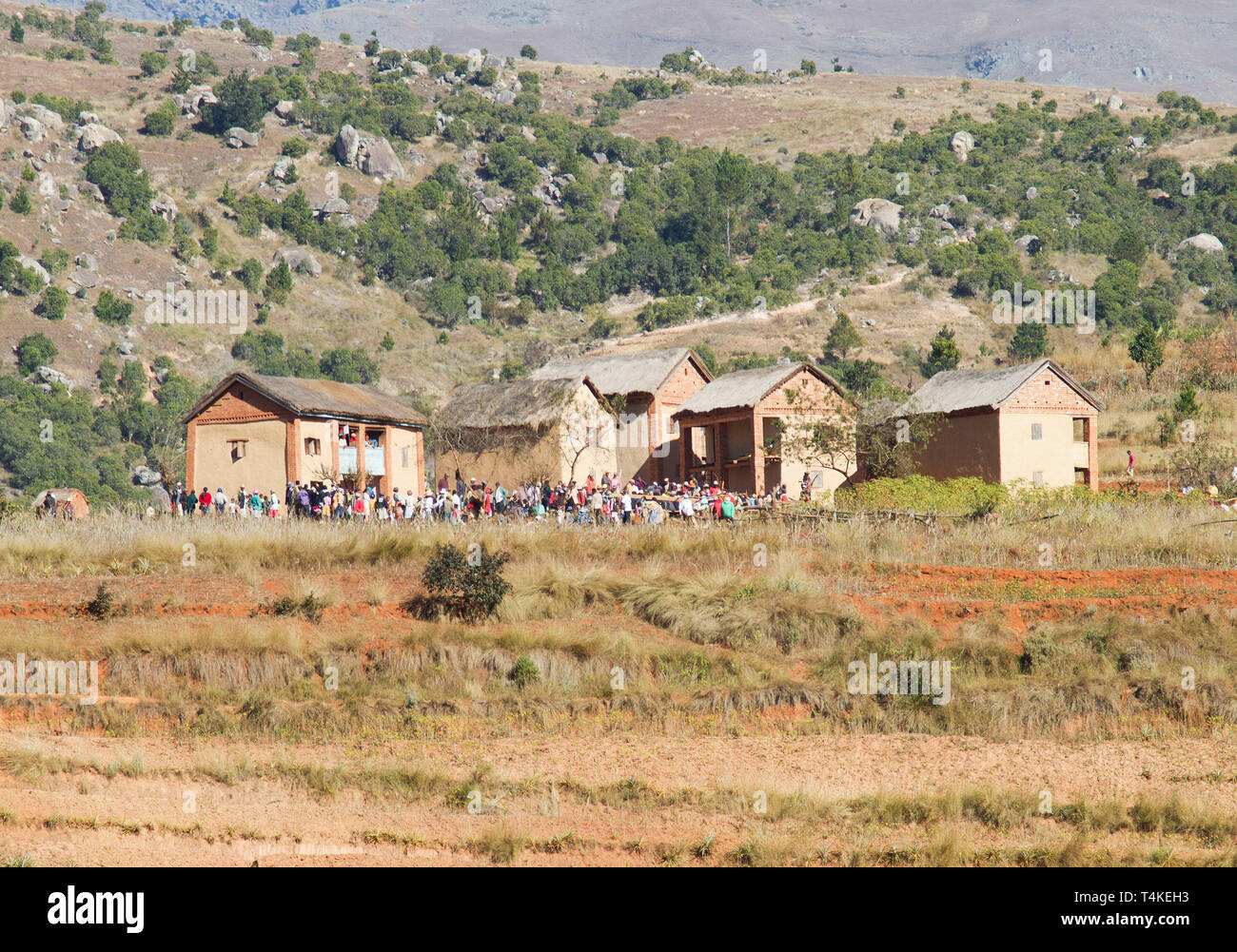 Malagasy People gathered for the ‘turning of the bones’ or a funeral in the hill country of Madagascar,Africa Stock Photo