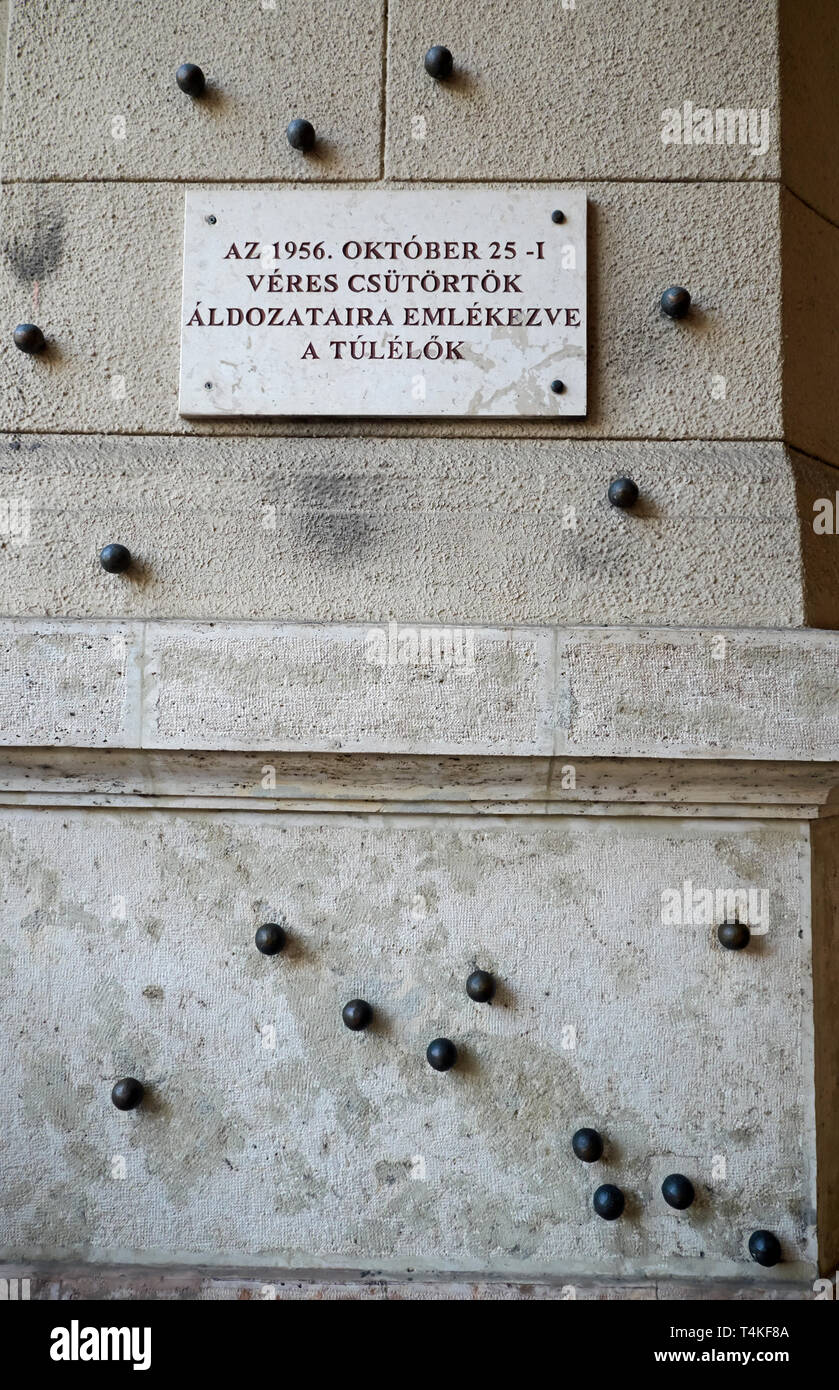 Bullet hole markers at the Ministry of Agriculture form a memorial to those killed at Kossuth Lajos Square, Budapest, Hungary, on 25th October 1956. Stock Photo