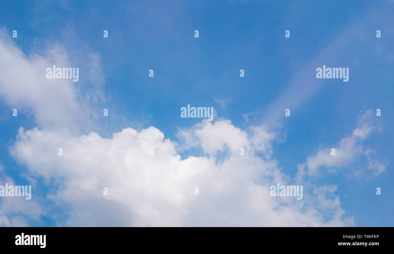 Fluffy clouds on blue sky, nature cloudscape background concept Stock Photo