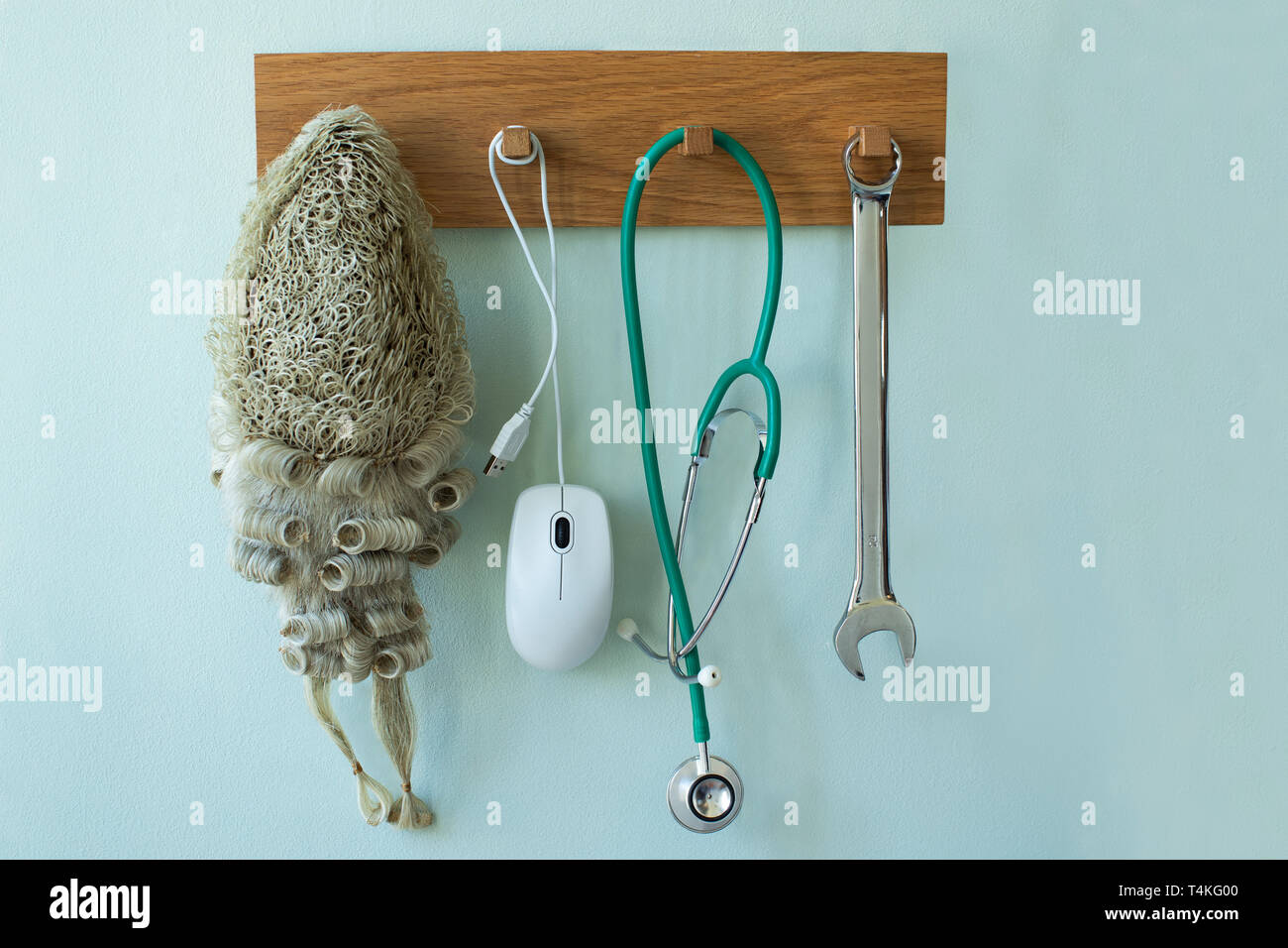Career Concept With Tools Associated With Different Professions Hanging On Wall Rack Stock Photo