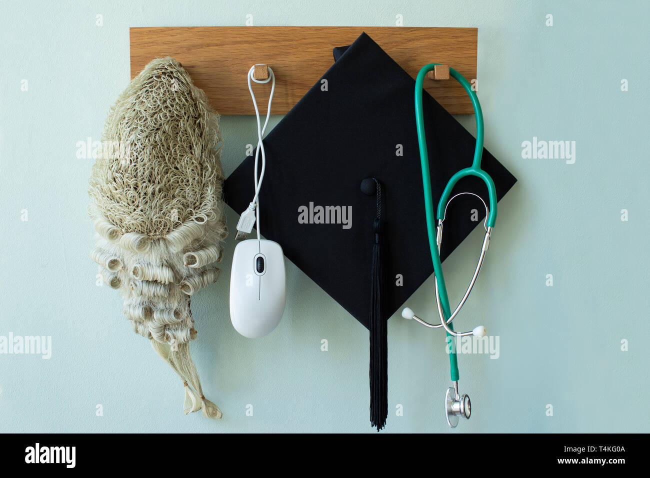 Career Concept With Tools Associated With Different Professions Hanging On Wall Rack Stock Photo