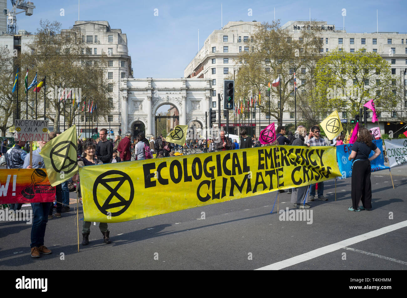 Demonstrators block the road with a banner reading 'Ecological Emergency Climate Crisis' at the Extinction Rebellion demonstration at Marble Arch Stock Photo