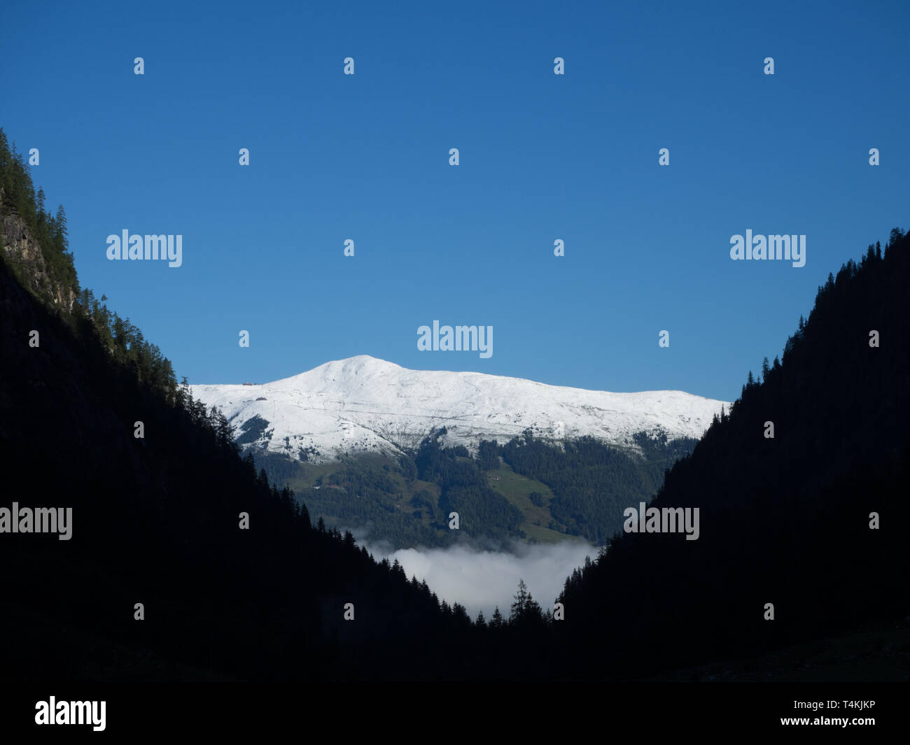 Valley view to snowcapped mountain Stock Photo