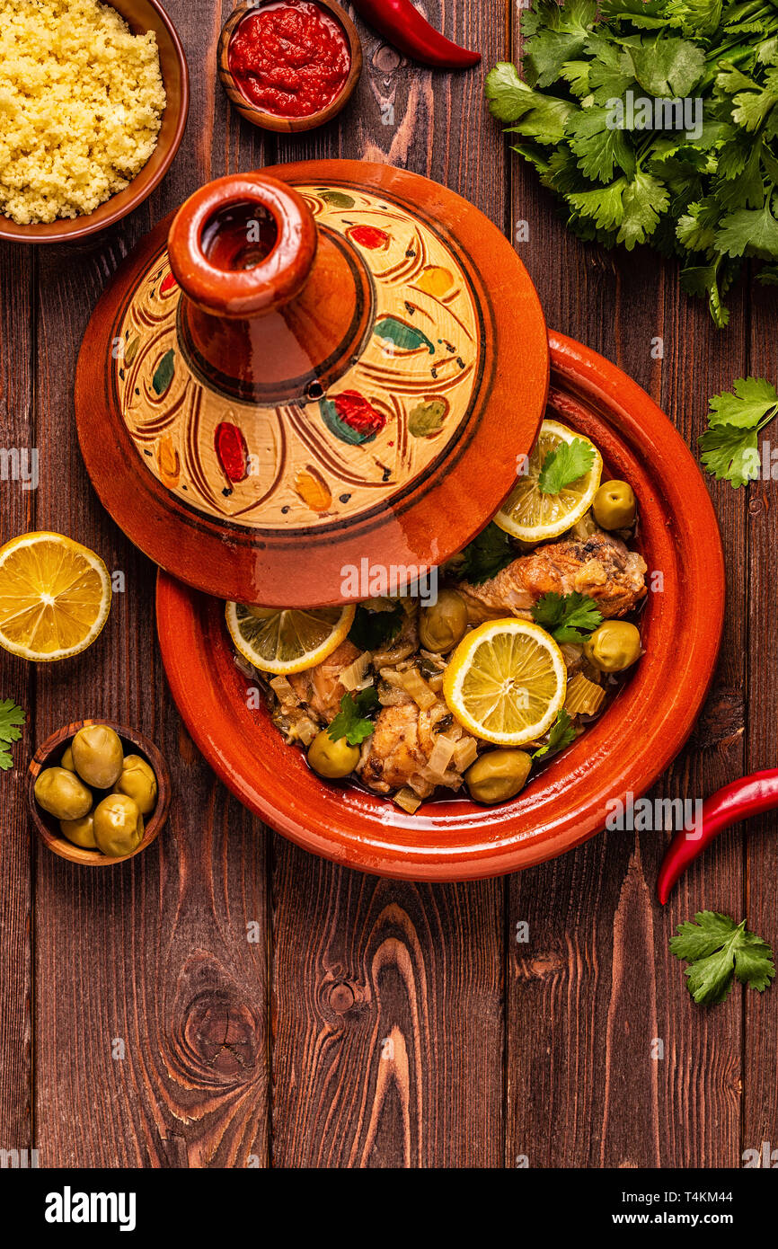 Traditional moroccan tajine of chicken with salted lemons, olives. Top view. Stock Photo