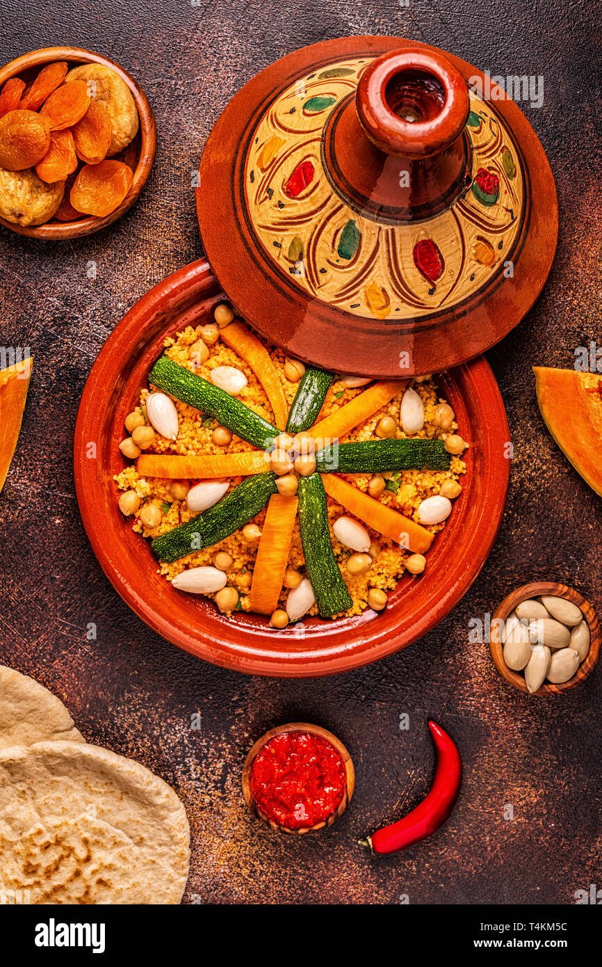 Vegetable tagine with almond and chickpea couscous, top view Stock