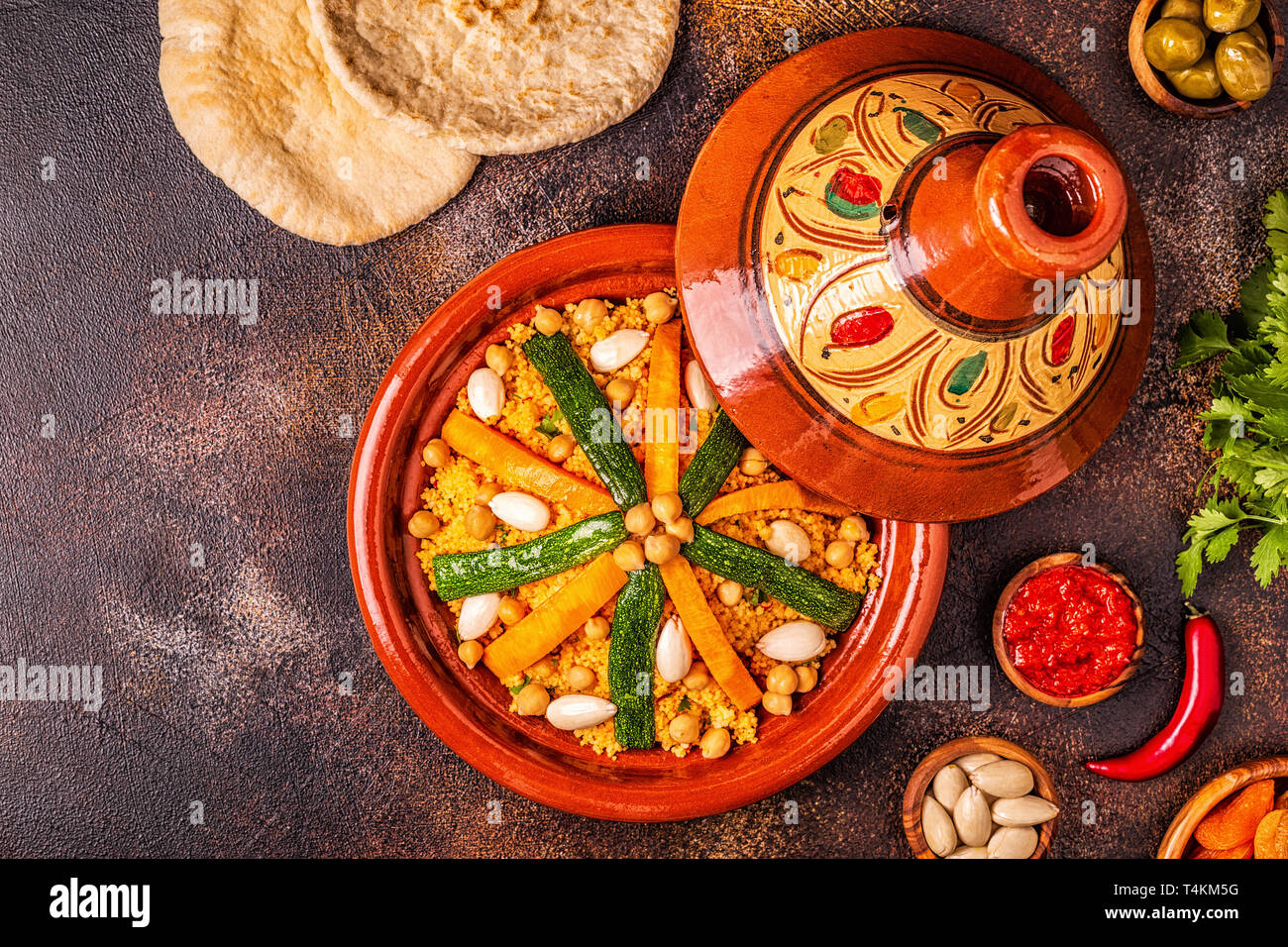 Vegetable tagine with almond and chickpea couscous, top view Stock