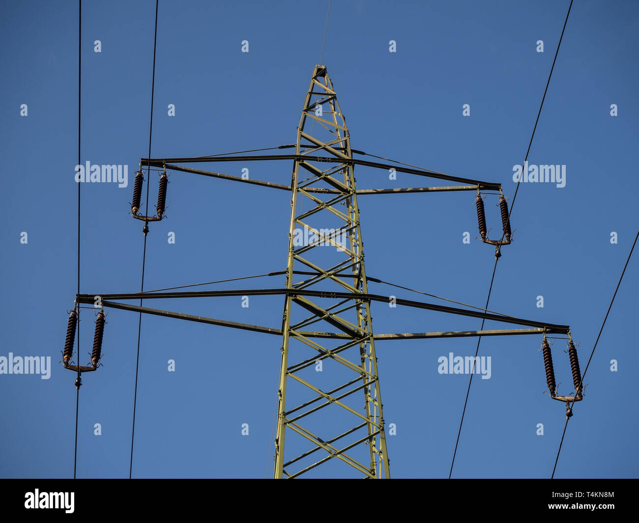 Electricity pylon and blue sky Stock Photo - Alamy