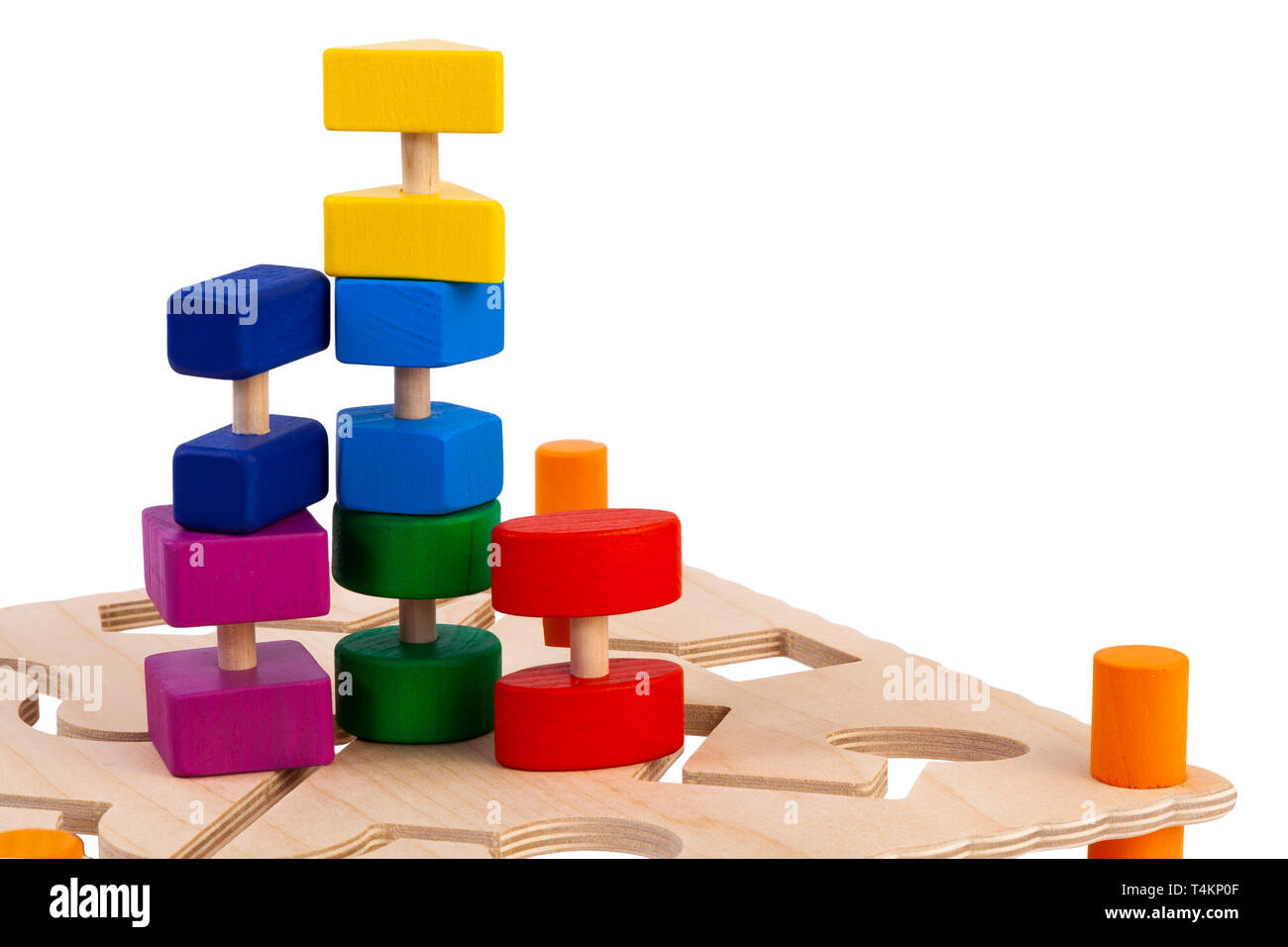 Сlose-up of a labyrinth with multi-colored puzzles on a wooden busy board- educational toy for children, babies on a white isolated background. A toy  Stock Photo